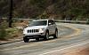 2011 Jeep Grand Cherokee LTD 4X4-2011-jeep-grand-cherokee-limited-4-x-4-front-three-quarters-motion.jpg